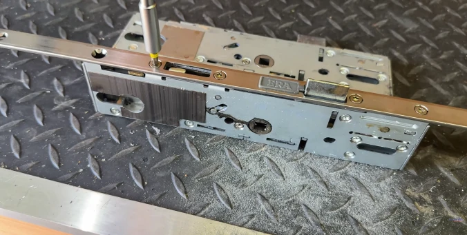 Mobile locksmith technician servicing a lock, representing Pine Belt Locksmith's mobile service in Oak Grove, MS