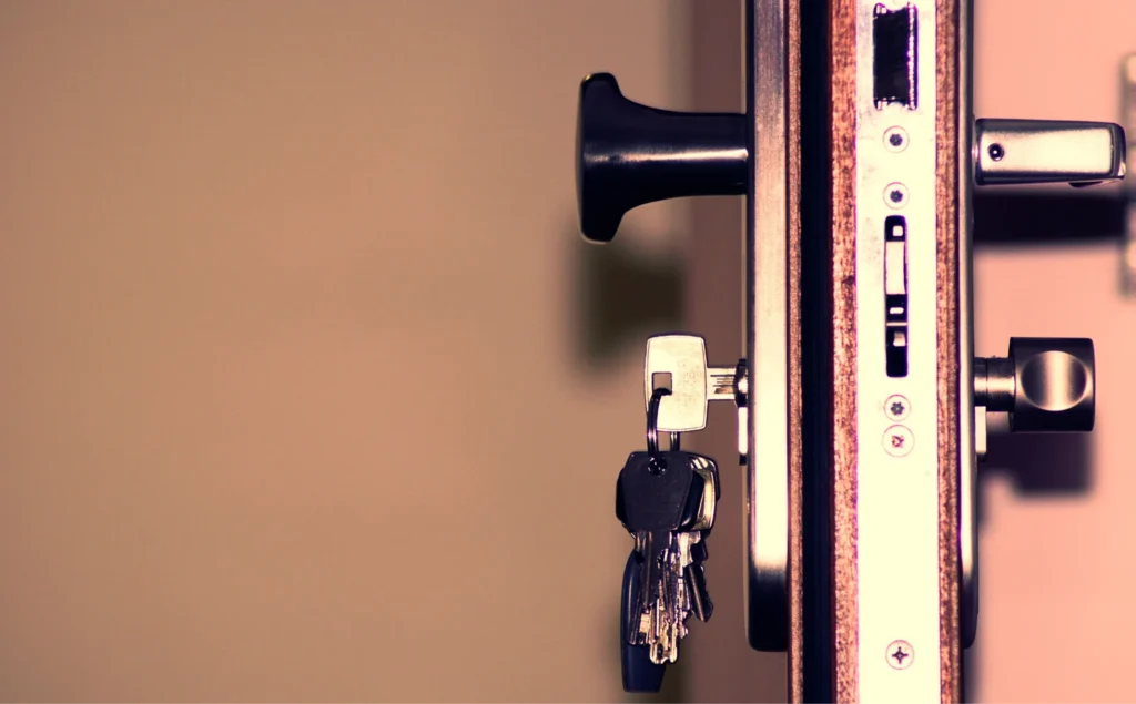 Keys in a door lock, representing the search for a trustworthy Hattiesburg locksmith
